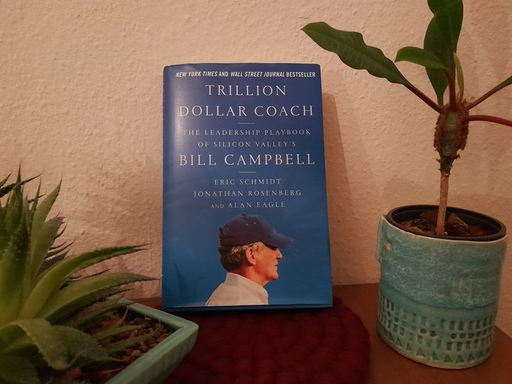 Trillion Dollar Coach Book Cover between plants